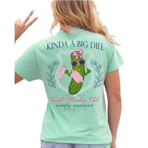 mint green Simply Southern 'Kinda A Big Dill' Short Sleeve Tee featuring a pickle with a pink bow a pink sling bag and pink cup