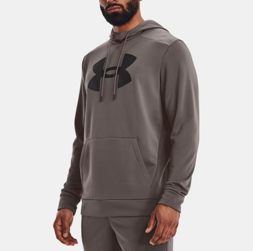 model wearing gray hoodie with draw strings and Under Armour logo on chest