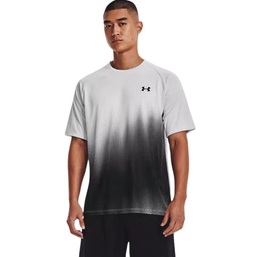 model wearing a gray fade to black under Armour tee and black bottoms