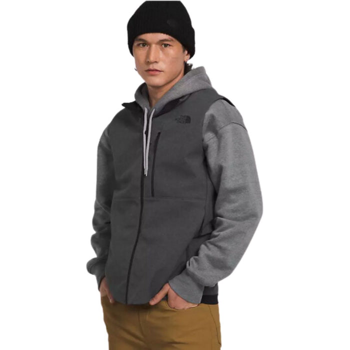 model waeing North Face Men’s Apex Bionic 3 full zip gray Vest over gray hoodie and tan bottoms and black beanie