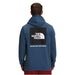 North Face Men's Box Nose Hoodie in navy worn by model with red bottom 