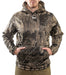 model wearing Banded Atchafalaya Pullover camo hoodie and tan bottoms