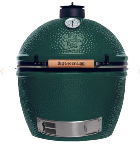 A big green egg charcoal grill, with a green ceramic body and metal accents in a size XL.