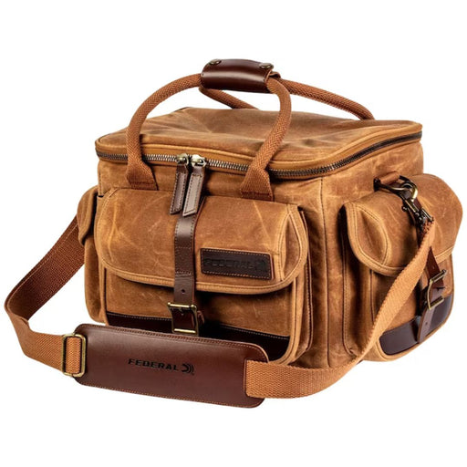 Tan range bag with multiple pockets zip top shoulder strap and handles