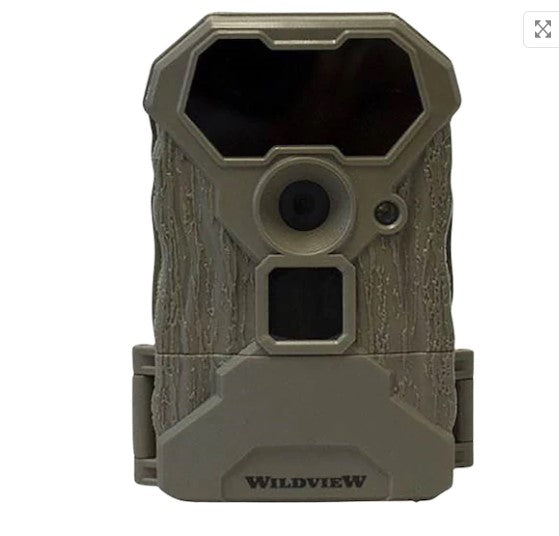 Browm trail camera with lens in the center and  tree bark texture.  