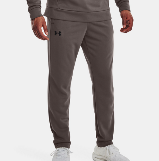 model wearing gray sweats with Under Armour logo on leg 