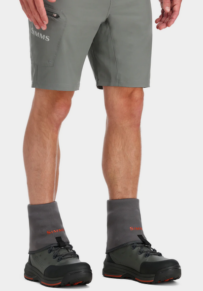 model wearing gray shorts boots and guide guard socks