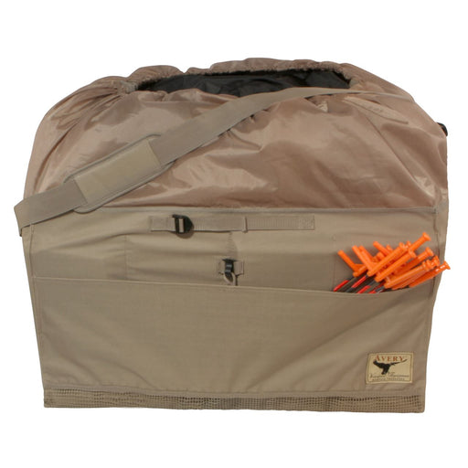 Large bag with shoulder strap and front pockets holding decoy stands. 
